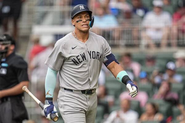 New York Yankees right fielder Aaron Judge (99) reacts after striking out against the Atlanta Braves during the first inning at Truist Park.