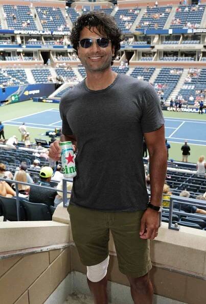Sendhil Ramamurthy enjoys a Heineken Silver at the Heineken Suite of the US Open at the USTA Billie Jean King National Tennis Center on August 28, 2024. 