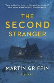 The cover of “The Second Stranger” is an illustration of a large old-fashioned hotel, heavily obscured by falling snow, in near-darkness.