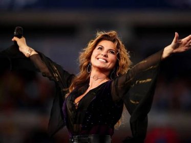 Shania Twain looks phenomenal in thigh-high boots and mini dress as she celebrates milestone with husband