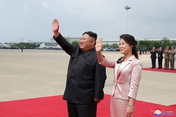  Kim and his former cheerleader wife Ri Sol Ju - he's thought to have developed a 'taste' for the Pleasure Squad six years ago