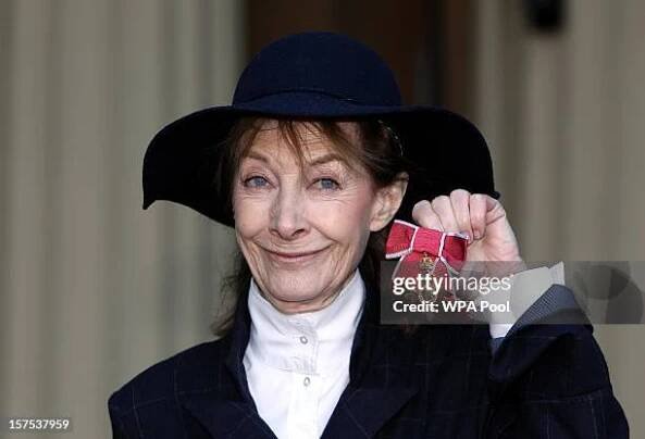 Actress Jean Marsh holds her Officer of the British Empire medal which was awarded to her by Queen Elizabeth II during an Investiture ceremony at...