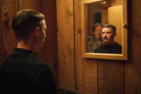 COME TO DADDY, Elijah Wood (left and reflected in mirror), Stephen McHattie, 2019. ph: Jamie Leigh Gianopolous / © Saban Films / courtesy Everett Collection