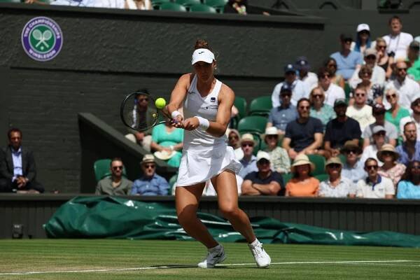 Beatriz Haddad Maia (BRA) with a forehand shot to Elena Rybakina (KAZ); All England Lawn Tennis and Croquet Club, London, England: Wimbledon Tennis Tournament