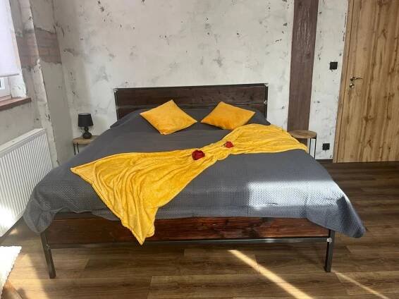 Postel nebo postele na pokoji v ubytování Apartmány v Podzámčí v blízkosti zámku Blatná