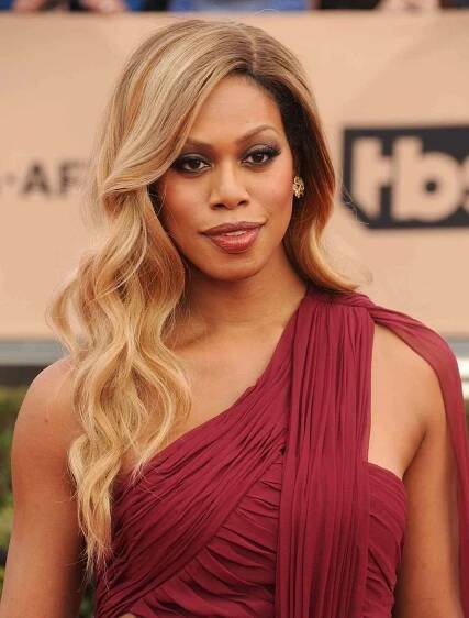 Laverne Cox long and glamorous caramel-hued dirty blonde hair