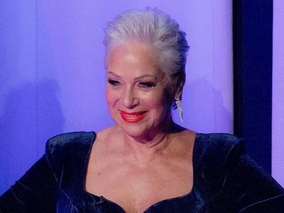 Denise Welch, 65, wows in plunging swimsuit and cowboy boots