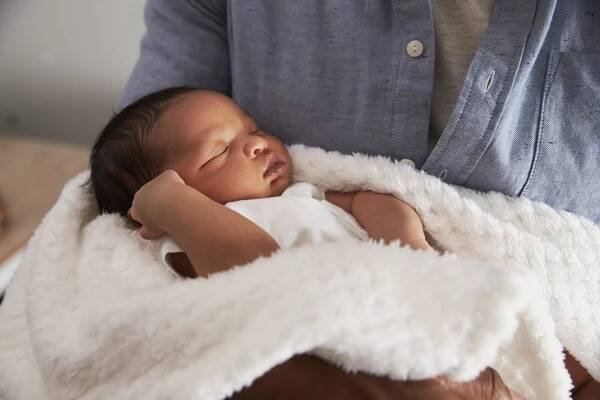 Close Up of Father Holding Newborn Baby Son in Nursery Stock Image - Image of carrying, care: 93539869