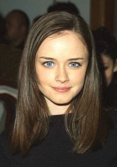 Alexis Bledel shines with her signature blue eyes and natural beauty at a public appearance during the early 2000s