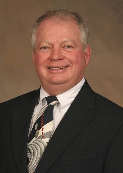 J. Michael Woods -                        Chairman