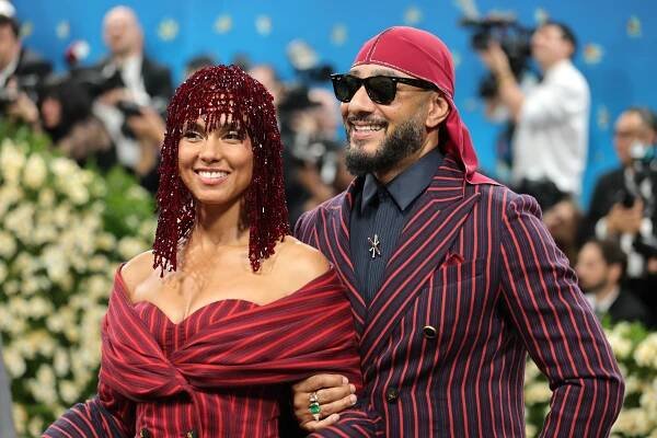 Alicia Keys and Swizz Beatz in red outfits at the Met Gala in 2025