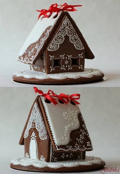 two gingerbread houses with red bows on them