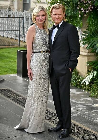 Kirsten Dunst, pictured with her husband Jesse Plemons, shines in a sequin-embellished halter gown by Chanel at the 2025 Bal d’Été