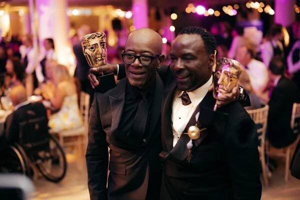  Lennie James and Ariyon Bakare pose in black tie with their TV Baftas