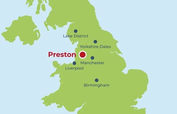 A zoomed in graphic of the United Kingdom with a red marker placed on where Preston is located on the map. Preston is located between Liverpool, Manchester and Yorkshire, and just 80 miles from the lake district. Blue map markers indicate the locations of