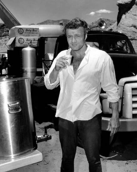 RUN OF THE ARROW, Brian Keith, cooling off on location in Utah, 1957