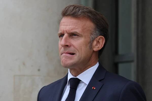 President Emmanuel Macron reacting.