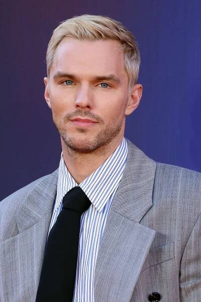 Image may contain Nicholas Hoult Blonde Hair Person Accessories Formal Wear Tie Blazer Clothing Coat and Jacket