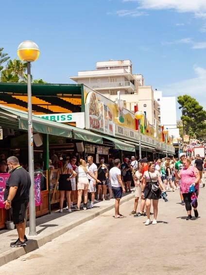 Palma de Mallorca, Spain - June 22, 2022: people have party at the Schinkenstrasse, engl: Ham Street at Ballermann - engl: fun man in Palma.