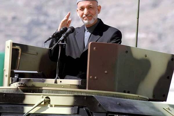 Karzai escapes again as Taliban attack parade
