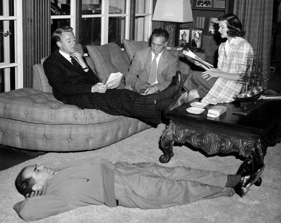 STATE OF THE UNION, director Frank Capra rests while Van Johnson, dialogue director Harold Winston, Katharine Hepburn, rehearse, 1948