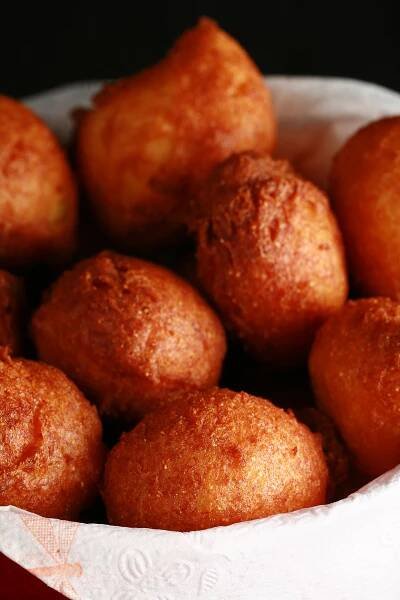 A bowl of gluten-free hushpuppies - little balls of deep fried cornmeal dough.