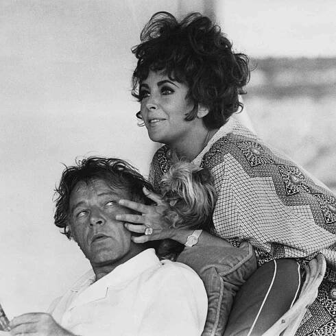 British-born actress Elizabeth Taylor and her husband, Welsh actor Richard Burton (1925 - 1984) on their yacht 'Kalizma' off Capo Caccia on the coast of Sardinia, August 1967. 