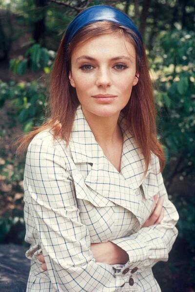 Jacqueline Bisset portrait in checked coat in park; circa 1970; New York