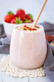 Strawberry Peanut Butter Smoothie served in a glass topped with goji berries