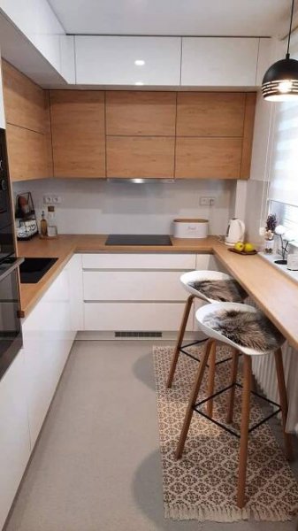 Modern Kitchen with White Cabinets and Wooden Countertops
