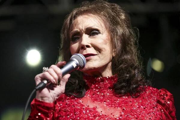 FILE - In this March 17, 2016, file photo, Loretta Lynn performs at the BBC Music Showcase at Stubb's during South By Southwest in Austin, Texas. Lynn, 85, has a fractured hip after a fall at her home in Tennessee. A statement on her website posted Monday said “she is doing well and thanks all her fans for their thoughts and prayers.” (Photo by Rich Fury/Invision/AP, File)