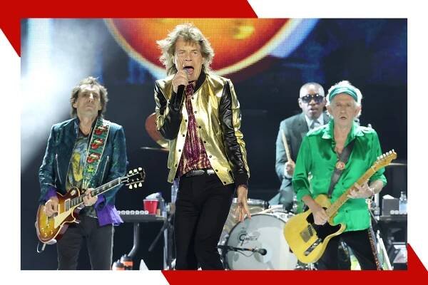 Mick Jagger rocks out in concert with Ronnie and Keith behind him.