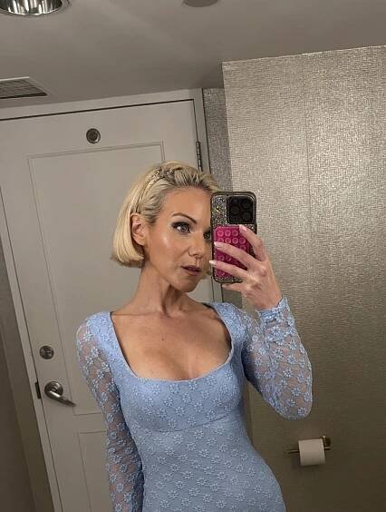Micaela English in a blue dress