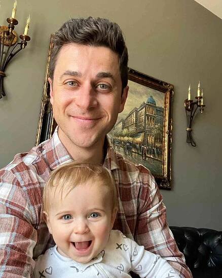 David Henrie smiling with his youngest daughter, Gemma, in July 2023.