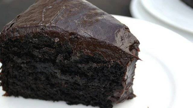 a piece of chocolate cake on a white plate