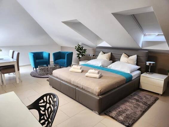 Postel nebo postele na pokoji v ubytování Wellness Apartmány EMPORIO