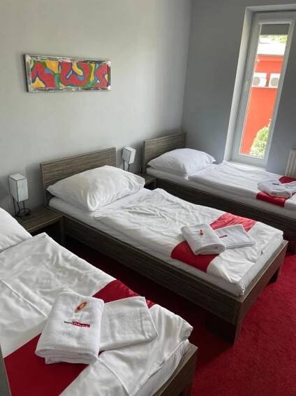Postel nebo postele na pokoji v ubytování Hotel Olympia