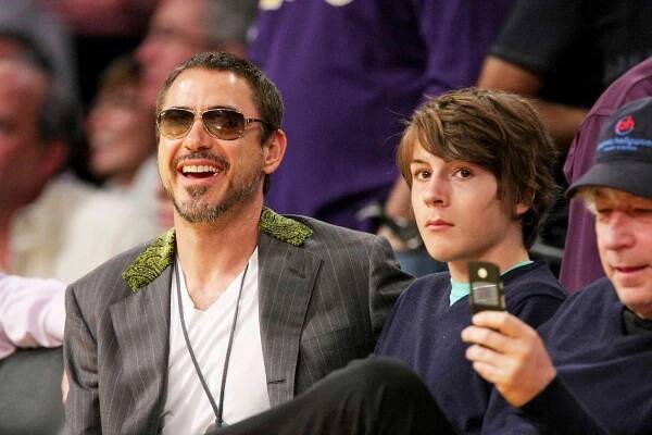 Robert Downey Jr. (L) and his son Indio Downey (R) attend the Los Angeles Lakers against Utah Jazz playoff game at the Staples Center on May 4, 2008 in Los Angeles, California.