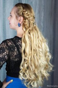 side of wavy hair in braided crown half up hairstyle