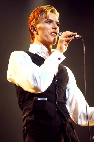 David Bowie performing on stage.