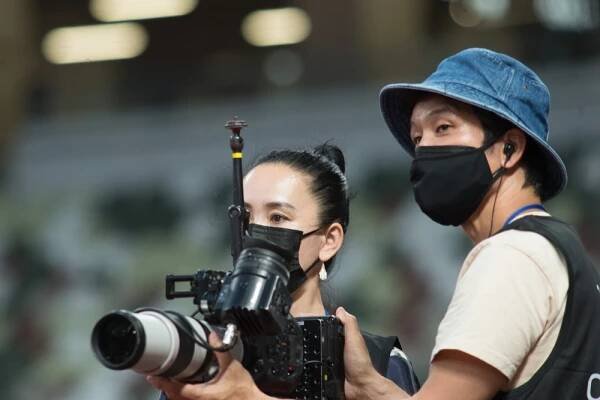 Archive photos taken on May 9, 2021 of Film Director Naomi Kawase and an assistant attend a test event at Tokyo’s National Stadium prior to the Olympics Games. (ANJ)