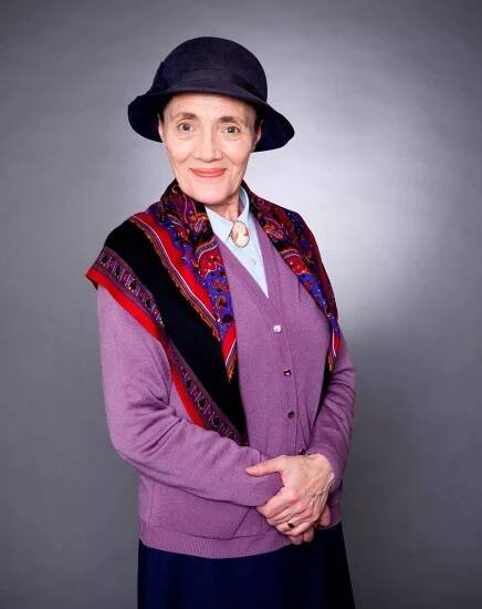 Emmerdale's Edna Birch in a purple cardigan and black hat