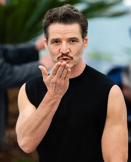 Pedro Pascal blowing a kiss toward the camera at Cannes
