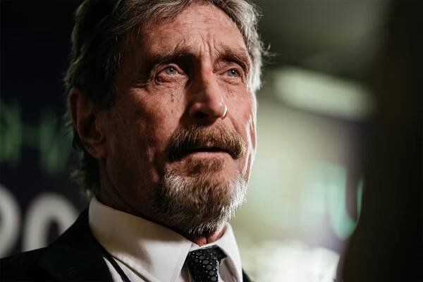 Image may contain John McAfee Face Human Person Tie Accessories Accessory and Beard