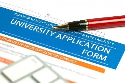 A blank university application form and a red pen