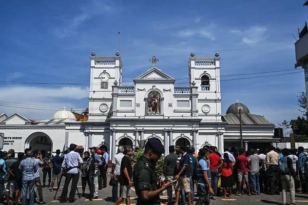 Local residents gather outside the St. Anthony's Shrine in Colombo Sri Lanka.