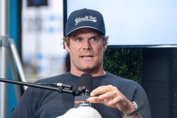 Greg Olsen speaking into a microphone at Radio Row.