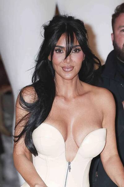 Kim Kardashian at Skims NYC store opening on knee scooter