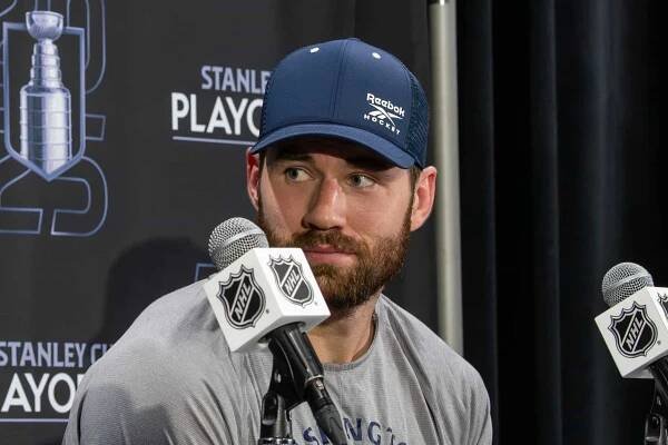 Tom Wilson wearing an Adidas Hockey hat