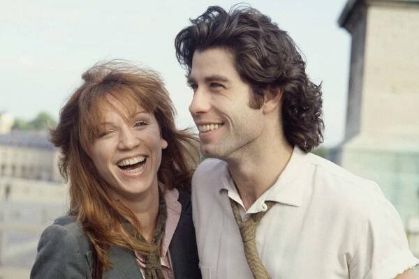 American actor John Travolta and his fiancée Marilu Henner on the esplanade of Versailles castle. (Photo by James Andanson/Sygma via Getty Images)